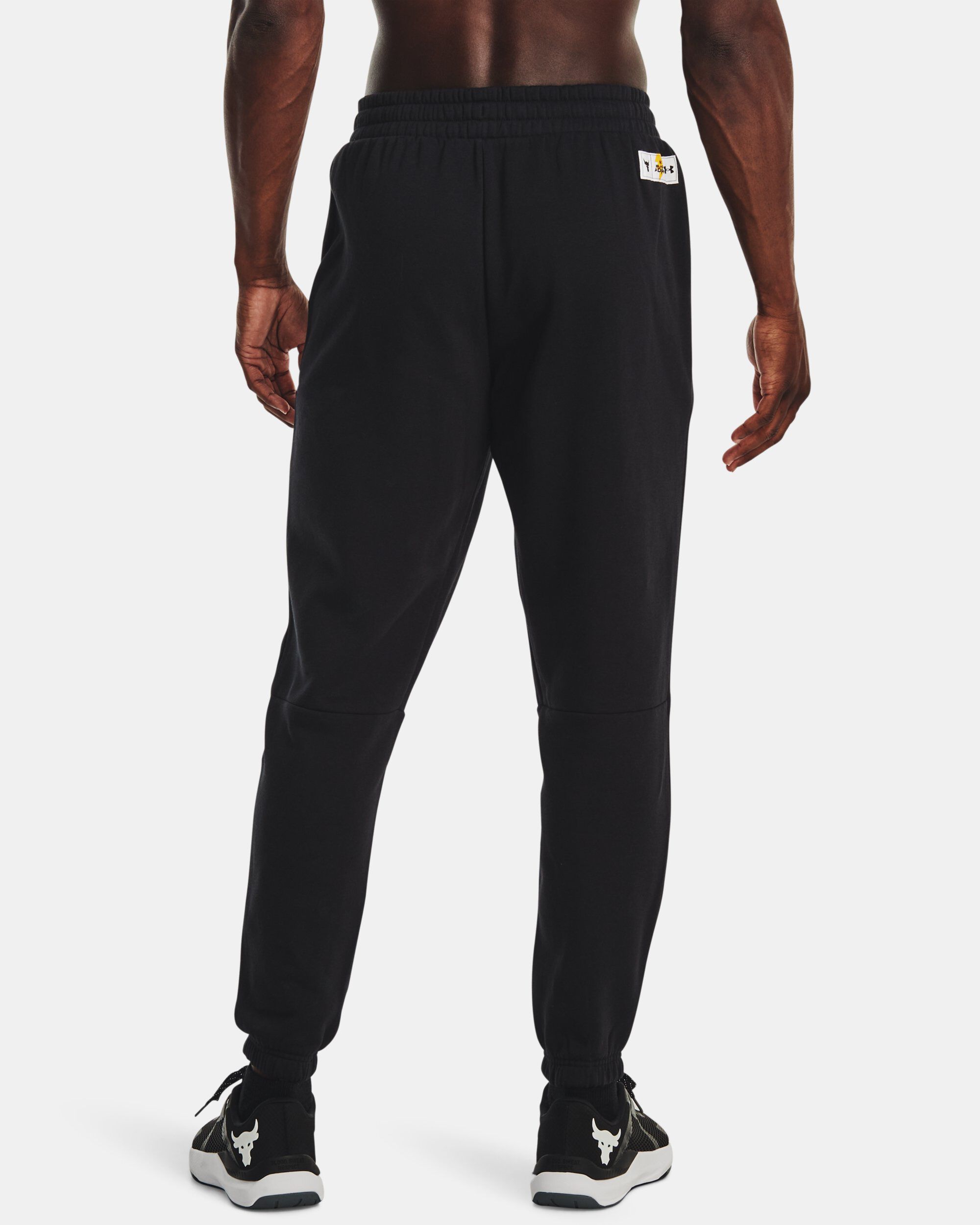 Buy Men s Project Rock Rival Fleece Black Adam Joggers Black in Dubai UAE Under Armour