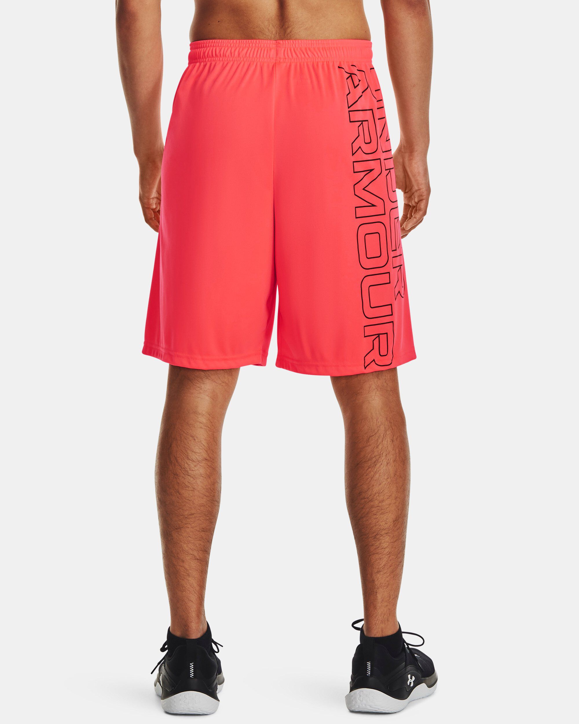 Shop Under Armour UA Tech™ Wordmark Graphic Men's Shorts Red in